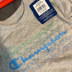 Grey champion kids shirt with blue and green logo